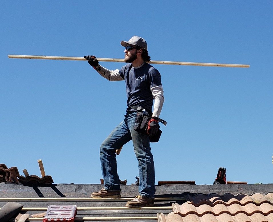 Rational Roofing crew tracing and repairing a roof leak in Orange County.